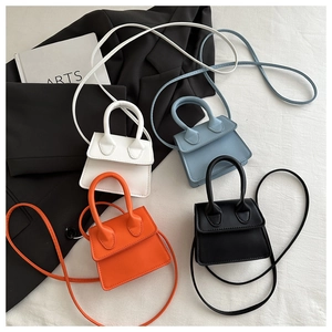Group display of mini crossbody bags in white, blue, orange, and black finishes