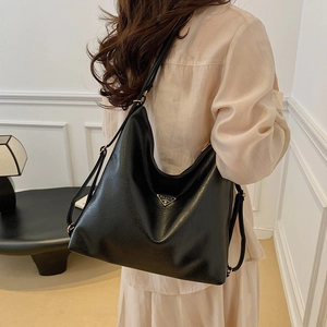 Classic black leather hobo bag with metal logo and shoulder strap for women