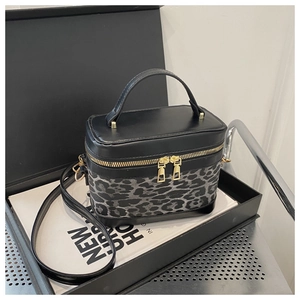 Top view of leopard print crossbody bag with gold zippers and black leather detail