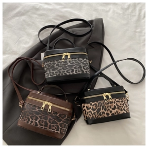 Detailed comparison of three leopard print PU leather box bags in different color variants