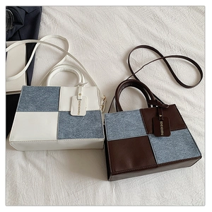 Detailed comparison of two-tone denim and leather crossbody bags in blue and brown