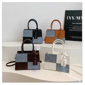 Detail view of four textured patchwork shoulder bags in black brown coffee and white colors