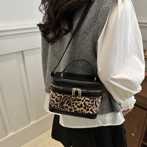 Leopard print crossbody bag with black paneling and gold zippers for women's fashion
