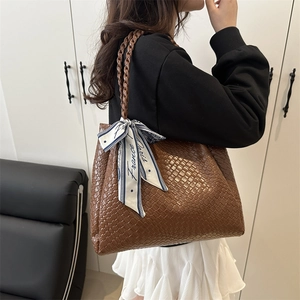 Brown woven leather tote bag for women with elegant decorative France Paris ribbon