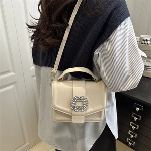 Elegant cream leather crossbody bag with sparkling rhinestone flower buckle for women