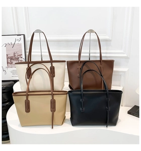 Minimalist tote bags in four colors arranged on a white display stand for commute