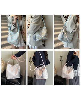 Detail view of jacquard shoulder bags with Chinese landscape patterns and long silk tassels