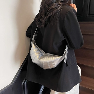 Silver metallic wax leather croissant bag with pleated stitching and wide strap