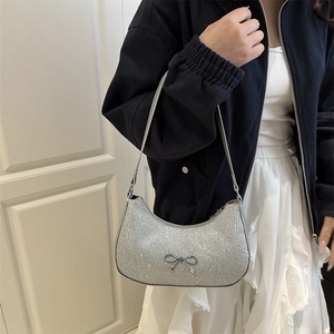 Silver glitter hobo shoulder bag for women with metallic bow detail and strap