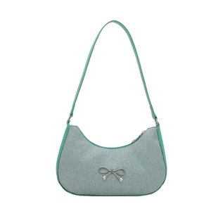 Elegant mint green crescent underarm bag with a silver bow and shimmering texture