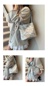 Detail of elegant Chinese style jacquard tote with mountain pattern and silk tassels