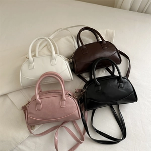 Chic solid color Boston bag set in white, brown, black, and pink with fashion embossing