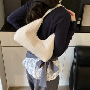 Minimalist beige woven tote bag for women with half-moon underarm shoulder design