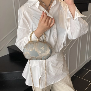 Embroidered grey evening clutch with gold floral patterns and pearl clasp for women