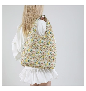 Detail of 3D floral embroidery and cute bear plushies on a large tote bag for women
