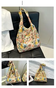 Detail of beige tote bag featuring cute 3D crochet flowers and teddy bear ornaments