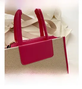 Detail of color-block small crossbody bag with off-white weaving and rose pink trim