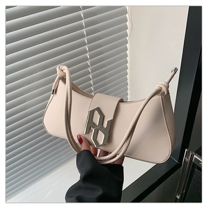 Detail of off-white crescent underarm bag with silver PD metal logo and knotted rope strap