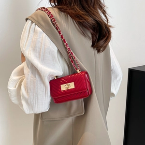 Chic red quilted leather crossbody bag with gold chain strap and turn-lock closure
