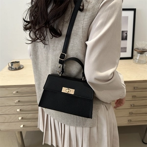 Classic black litchi leather crossbody bag with gold lock and top handle for women