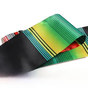Close-up of rainbow satin graduation stole featuring smooth texture and colorful stripes