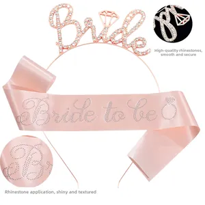 Detail of rose gold Bride headband and pink satin Bride to be sash with glittering rhinestones