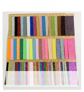 Close-up of glitter fabric color swatches in stretch cloth and PU leather textures