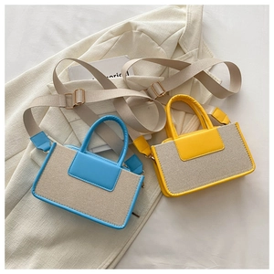 Detail view of mini crossbody bags with contrast weave texture and wide straps
