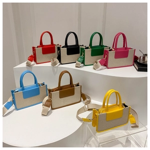 Selection of multi-color canvas crossbody bags with leather trim and wide straps