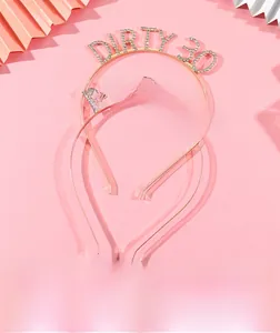 Detail of glittery Dirty 30 crystal headband for women in gold and rose gold finish