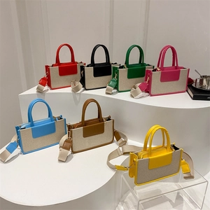 Minimalist canvas tote bag with colorful leather trim in seven stylish color variants