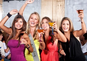 Women celebrating with silver satin birthday sash featuring black Fabulous text lettering