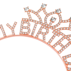 Macro shot of rose gold Happy Birthday headband with hand-set sparkling white rhinestones