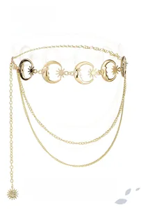 Baroque style gold metal waist chain with moon and star charms in detailed view