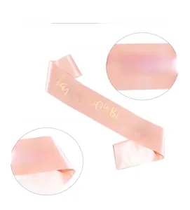 Detail of pink satin 50th birthday sash featuring premium gold foil stamping letters