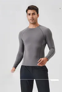 Detailed close-up of grey quick-dry sports t-shirt with breathable mesh and raglan sleeves