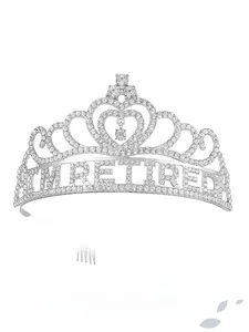 Detailed close-up of a silver tiara with rhinestones and I'M RETIRED text lettering