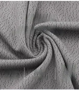 Detail of grey athletic fabric with breathable mesh, 90% nylon and 10% spandex blend