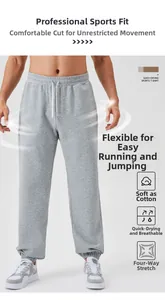 Detail of men's grey jogger pants showing elastic drawstring waist and breathable fabric