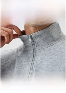 Detail of grey men's sweatshirt featuring a stand collar and high-quality half-zip closure