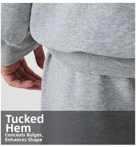 Detailed macro view of the ribbed elastic hem and soft knit fabric on a gray tracksuit