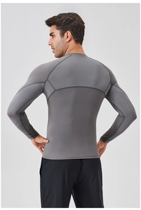 Detail view of honeycomb breathable mesh on men's gray compression training shirt