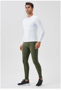 Detail of white compression top with mesh panels and green athletic leggings for men