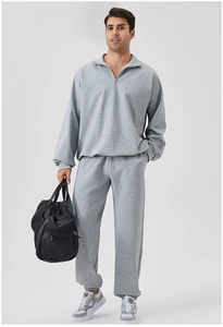 Front view of men's grey half-zip sports tracksuit with sweatshirt and matching joggers
