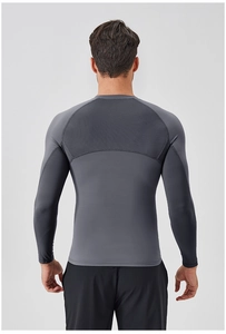Macro detail of breathable mesh paneling on a gray men's compression long sleeve athletic shirt