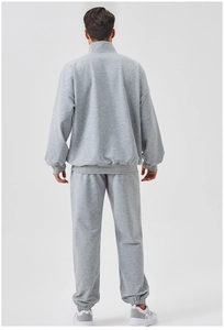 Rear view of men's grey loose-fit sports tracksuit with stand collar and jogger pants