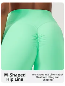 Detailed back view of high waist mint yoga shorts showing M-shaped butt lift and scrunch seam