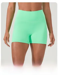 Detail of high waist seamless yoga shorts in mint green showing tummy control design