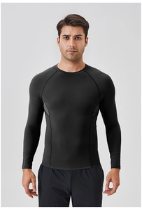 Close-up of reinforced seams on men's black compression long sleeve running shirt