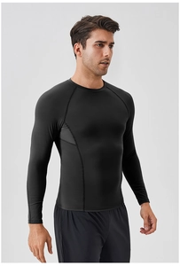 Detail of men's black compression long sleeve shirt showing raglan sleeves and stitching